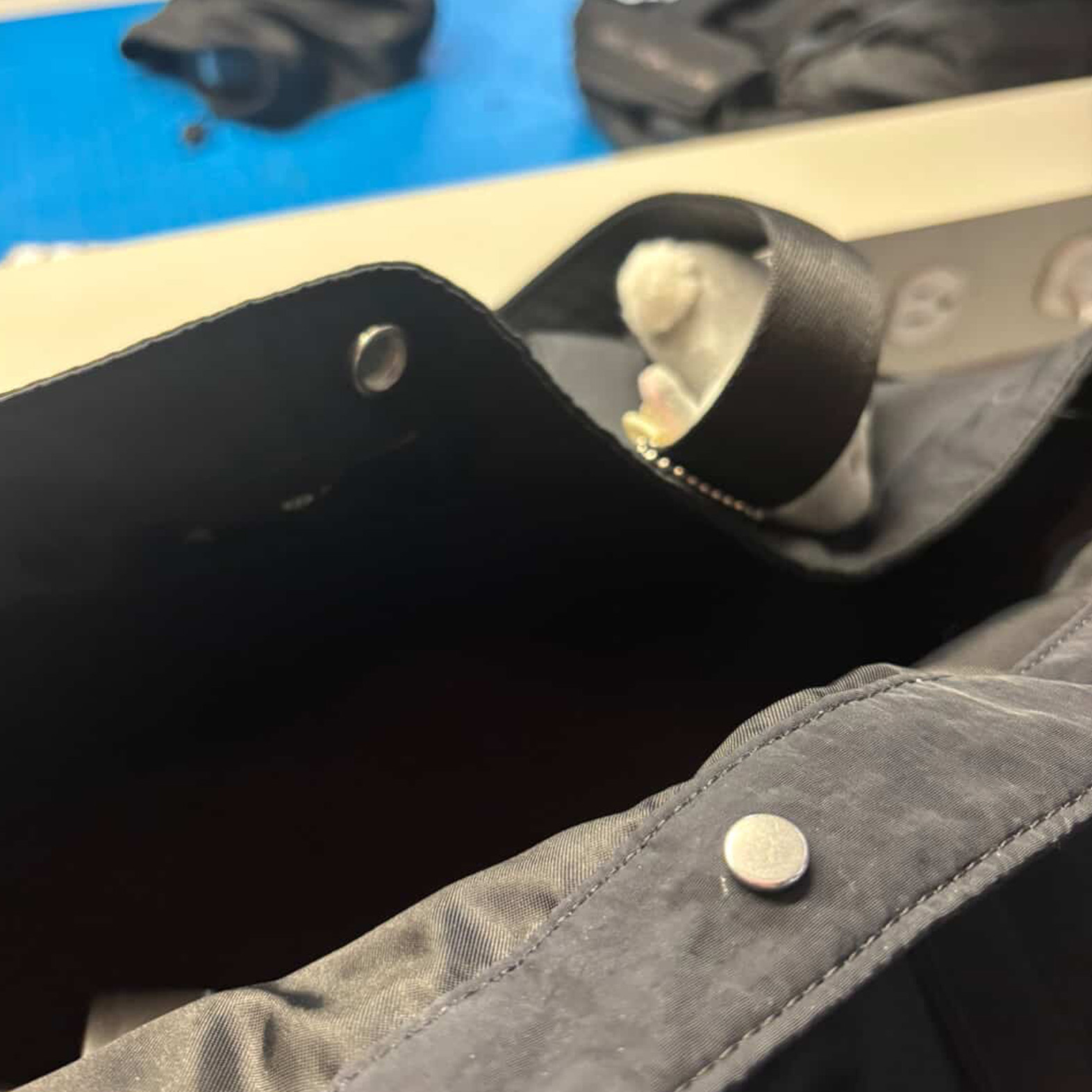 An interaction depicting the opening and closing of a jacket button. There is potential for a circuit to be formed that activates once the button is closed.