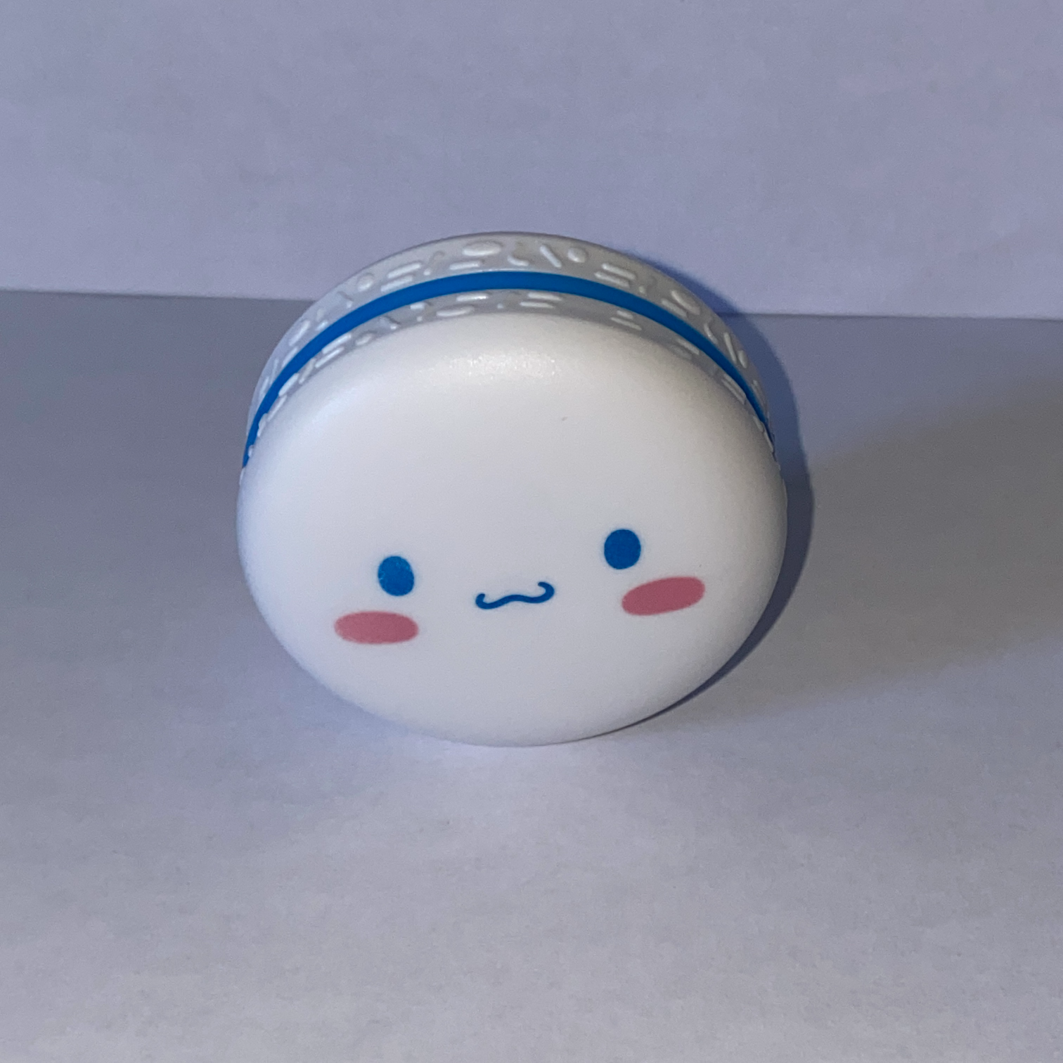 An image of a chapstick container.