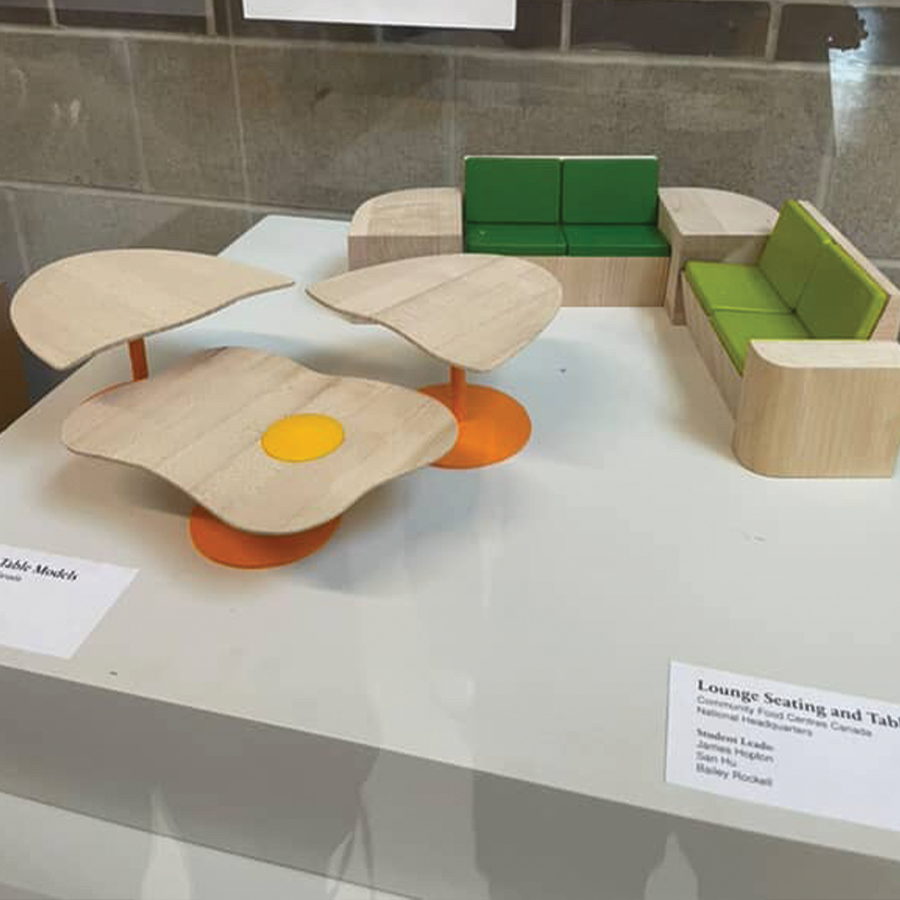 This is an image of a mini lounge furniture set created out of wood, created by a student part in the craft and design furniture program.